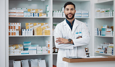 Buy stock photo Pharmacist, man and arms crossed with medicine, portrait and confident with trust, healthcare and happiness. Face, Latino male and employee with smile, pharmacy and wellness in store and happy expert