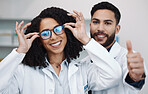 Vision portrait, doctor thumbs up and smile of a female healthcare worker in a hospital. Agreement, glasses choice and happy woman looking at lens and frames options in a optometrist clinic 