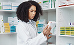 Pharmacy, medicine and retail with black woman in store for healthcare, drug dispensary and treatment prescription. Medical, pills and shopping with pharmacist for check, label information or product
