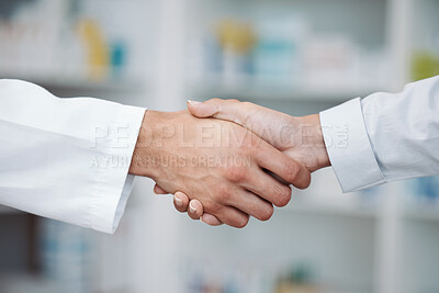 Buy stock photo Doctor, handshake and partnership in support at pharmacy for healthcare success, promotion or deal at clinic. Medical expert shaking hands in teamwork for life insurance, b2b or pharmaceutical needs