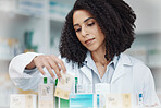 Pharmacy, medicine and pills with black woman in store for healthcare, drugs dispensary and treatment prescription. Medical, shelf and shopping with pharmacist for check, label information or product