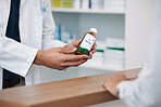 Doctor, hands and prescription medicine over the counter for consultation, healthcare or pharmaceutical product at clinic. Hand of pharmacist showing medical solution for healthy cure at pharmacy