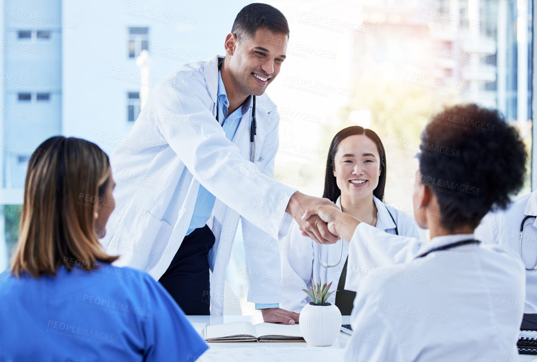 Buy stock photo Handshake, doctors and medical meeting in agreement, collaboration and smile of teamwork, welcome or deal. Happy healthcare employees shaking hands in hospital partnership, greeting or clinic success