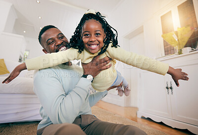 Buy stock photo Black man, father and daughter with plane game, happiness and smile for love, bonding and care on bedroom floor. Happy family home, airplane games and dad with holding, balance and happy with playing