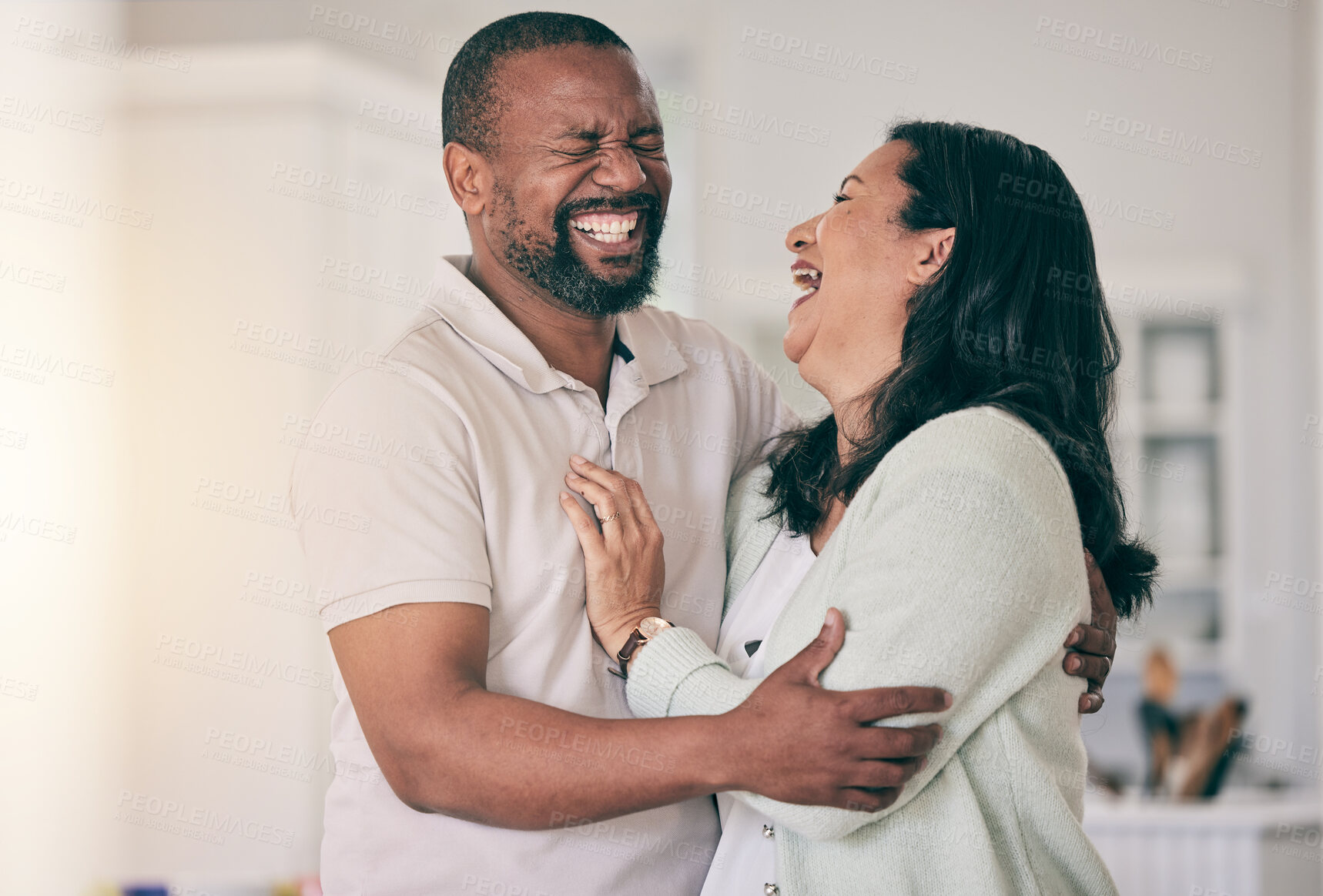 Buy stock photo Senior black couple, home and laugh together with hug, happiness or relax for funny memory with love. Black man, woman and mature in house for embrace, comic time or bonding for comedy, happy or care