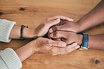 Closeup of couple holding hands for support, empathy and help with news, depression or mental health problem. Therapy, psychology and depressed, sad or anxiety of mature man and woman hand together