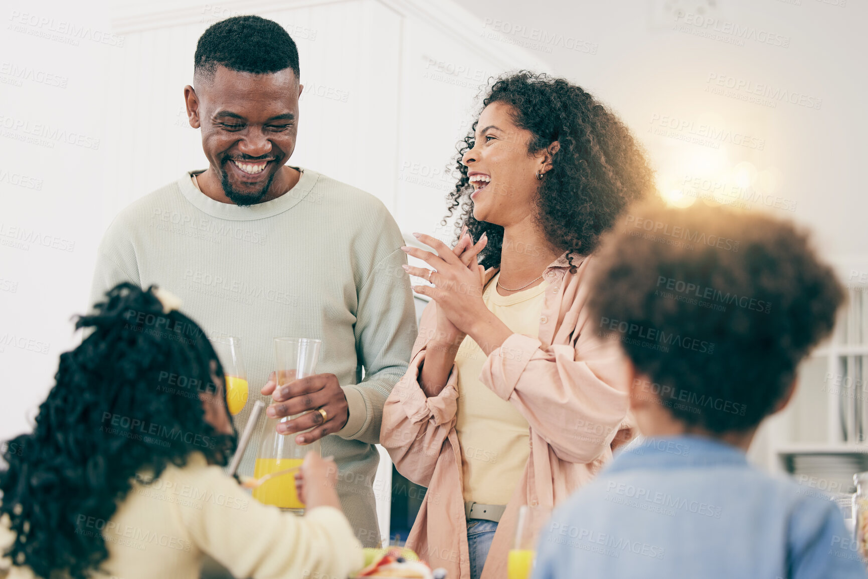 Buy stock photo Love, funny and black family with juice, smile and cheerful with quality time, joy and bonding. Parents, mother and father with children, refreshments or kids with happiness, loving or relax together