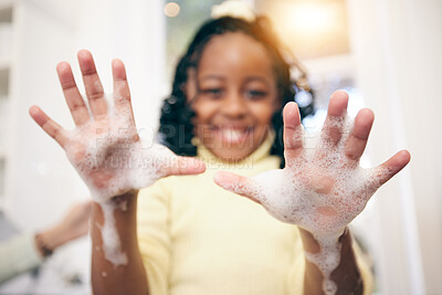 Buy stock photo Washing hands, girl and portrait with soap foam in a bathroom with blurred background. Hygiene, cleaning and young child in a home with happiness and a kid smile with a clean hand in a house