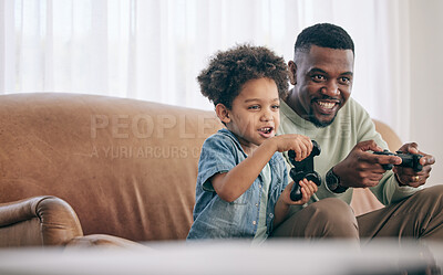 Buy stock photo Black family, dad and child playing video games on living room sofa together with controllers at home. Happy African American father with son with smile enjoying bonding time on console entertainment