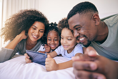 Buy stock photo Phone, bedroom and family watching a video on social media, mobile app or the internet together. Happy, bonding and African children streaming a movie or film on cellphone with their parents at home.