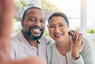 Buy stock photo Happy, mature and portrait of an interracial couple with a selfie for a memory, together and relationship. Smile, love and a black man with a woman taking a photo, looking and joyful at home