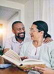 Home reading, black couple and marriage with love, support and care in a house. Book, smile and happiness of a older woman and man together feeling happy in early retirement in the morning with books