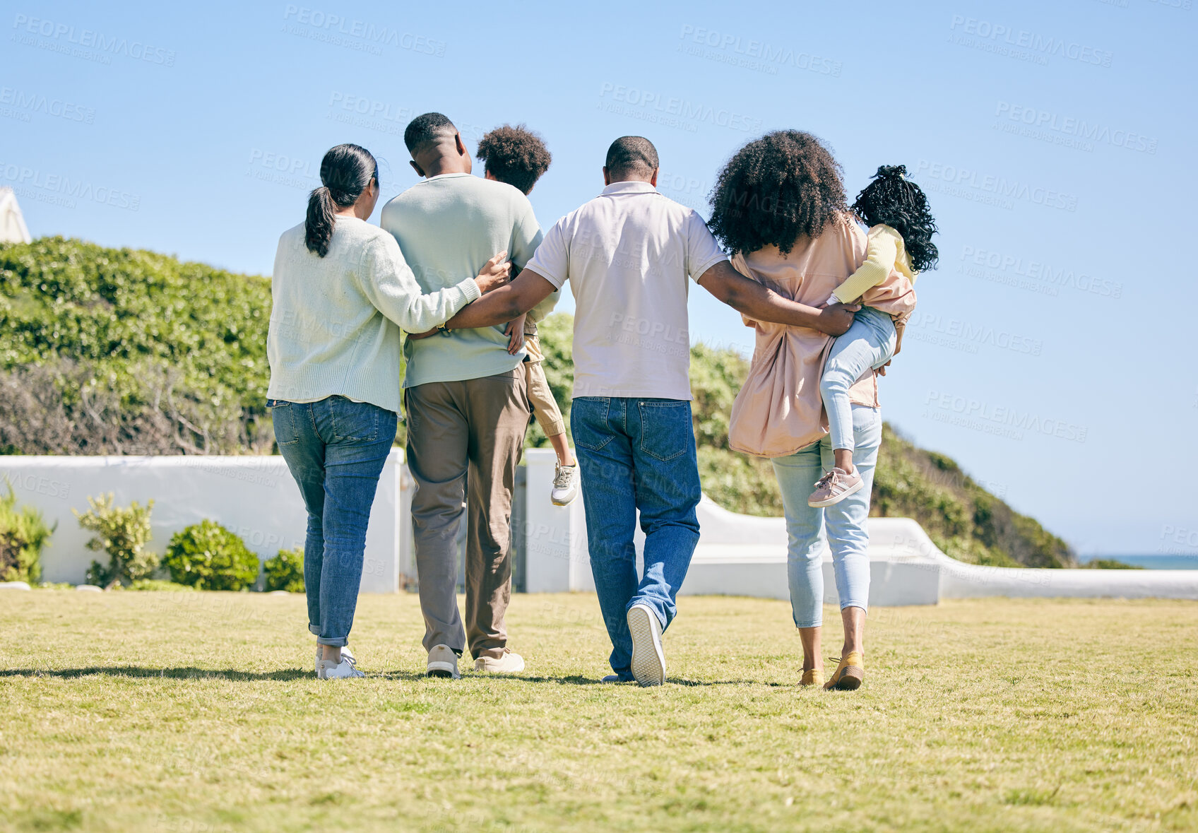 Buy stock photo Grandparents, parents and children walking in garden for bonding, quality time and relax together. Family, love and back of happy mother, father and kids enjoy holiday, summer vacation and weekend