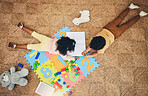 Top view, numbers puzzle and children on floor with toys, drawing in book and playing together at home. Family, educational games and happy boy and girl do fun activity, creative learning and relax 