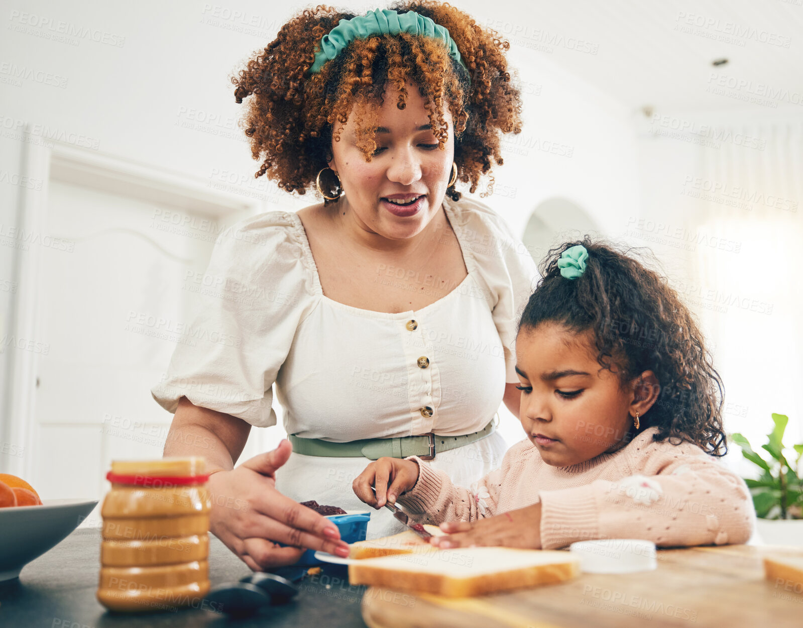 Buy stock photo Love, breakfast food and black family child, mother or people eating meal, bonding and prepare ingredients. Morning cooking, kitchen counter or hungry mom with young kid making peanut butter sandwich