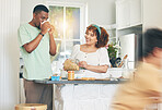 Love, coffee and couple in the kitchen for breakfast together in their modern family home. Happiness, smile and young man drinking a cappucino while bonding and cooking with his wife at their house.