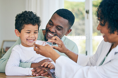 Buy stock photo Father, boy child and optometrist for glasses, eye care and fitting frame with smile, happiness or healthcare. Black man, ophthalmologist woman or kid with service, lens or happy for choice at clinic