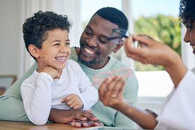 Buy stock photo Happy child, glasses choice and father in a doctor office for vision and eye exam with pediatrician. Happiness, dad and young boy together at a clinic looking and lens and frames after a eyes test