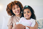 Portrait, smile and mother and child or kid bonding with care, unity and love spending quality time together. Single parent, daughter and happy mom with little or young girl in a home or house 