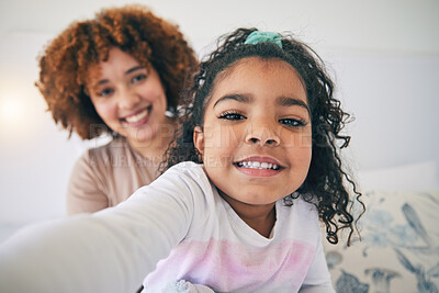 Buy stock photo Mother, bedroom and young girl selfie on a bed in the morning in a family home. House, smile portrait and happy mom with a child taking a picture for social media with mama love and care for her kid