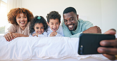 Buy stock photo Love, bedroom and selfie of happy black family bonding, relax or enjoy quality time together on Jamaica holiday. Youth children, parents and morning memory photo of kids, mother and father on bed