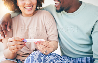 Buy stock photo Happy, couple and pregnancy test, smile and excited for good news, positive and results in their house. Hands, woman and man with home testing kit, pregnant and fertility or ivf success while hugging