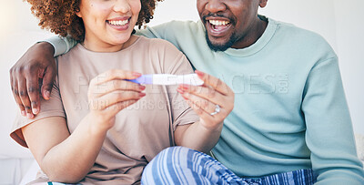 Buy stock photo Couple, happy and pregnancy test, smile and excited for good news, positive and results in their house. Hands, woman and man with home testing kit, pregnant and fertility or ivf success while hugging