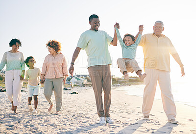 Buy stock photo Family, grandparents and kids at beach, holding hands and jump with swing, happiness or bonding on holiday. Parents, children and senior people for love, vacation or summer sunshine in morning by sea