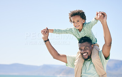 Buy stock photo Black family, man and a son sitting on shoulders while outdoor in nature together during a beach vacation. Love, sky or kids with a father or parent carrying his child while walking on the coast