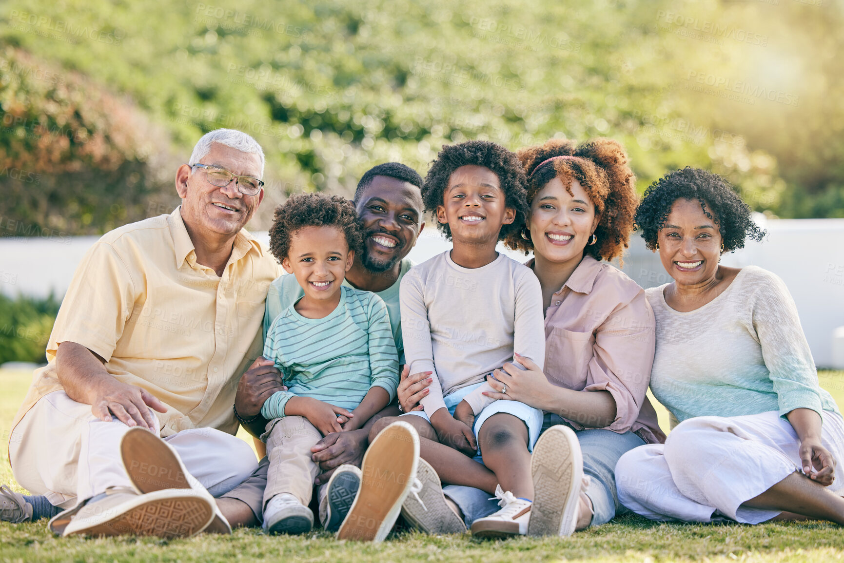Buy stock photo Portrait of grandparents, parents and children on grass enjoy holiday, summer vacation and weekend. Black family, garden and happy mom, dad and kids smile for quality time, relax and bonding outdoors