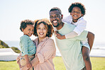 Happy, smile and portrait of a black family at beach for travel, vacation and piggyback on nature background. Relax, face and trip with children and parents embrace and bond while traveling in Miami