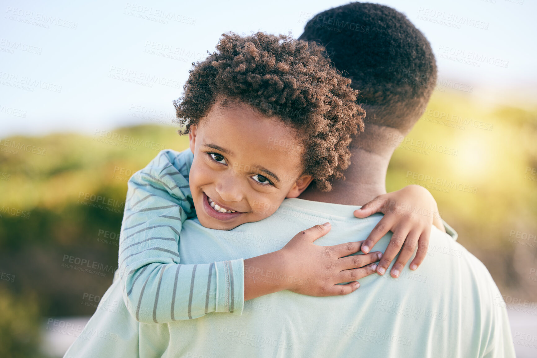 Buy stock photo Hug, happy and portrait of a father with a child in nature for love, support and bonding in Jamaica. Smile, care and little boy hugging his dad, holding and together for quality time outdoors