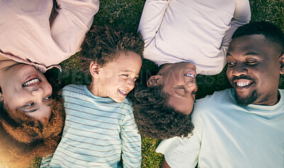 Buy stock photo Smile, happy black family on grass from above mother, father and children lying together. Weekend, relax and people in garden, top view of woman, man and kids with happiness and love in South Africa.