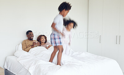 Buy stock photo Love, parents in bed and children jumping, quality time and happiness with bonding, home and cheerful. Family, energy and siblings with mother, father and kids playing in bedroom, joyful and morning