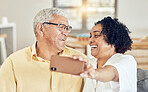 Senior couple, smile and selfie in house with love, bonding and hug for support, relax and laugh on blog app. Elderly man, old woman and social media ux for comic profile picture in home living room