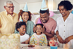 Birthday, party and surprise with black family in kitchen for celebration, bonding and affectionate. Happiness, excited and care with parents and child at home for generations, fun and special event 