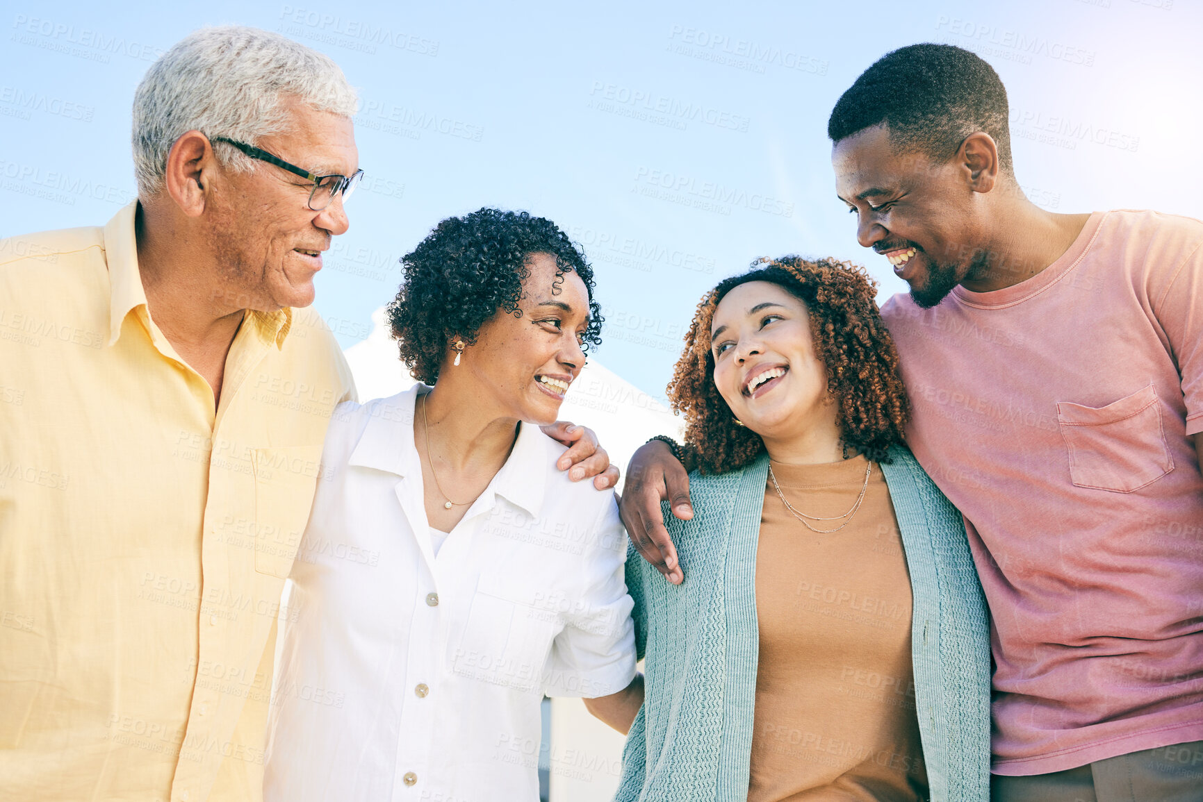 Buy stock photo Happy family, couple and parents on vacation or holiday bonding together smile and having fun outdoors. People, man and woman embrace with mother and father as love, care and support during weekend