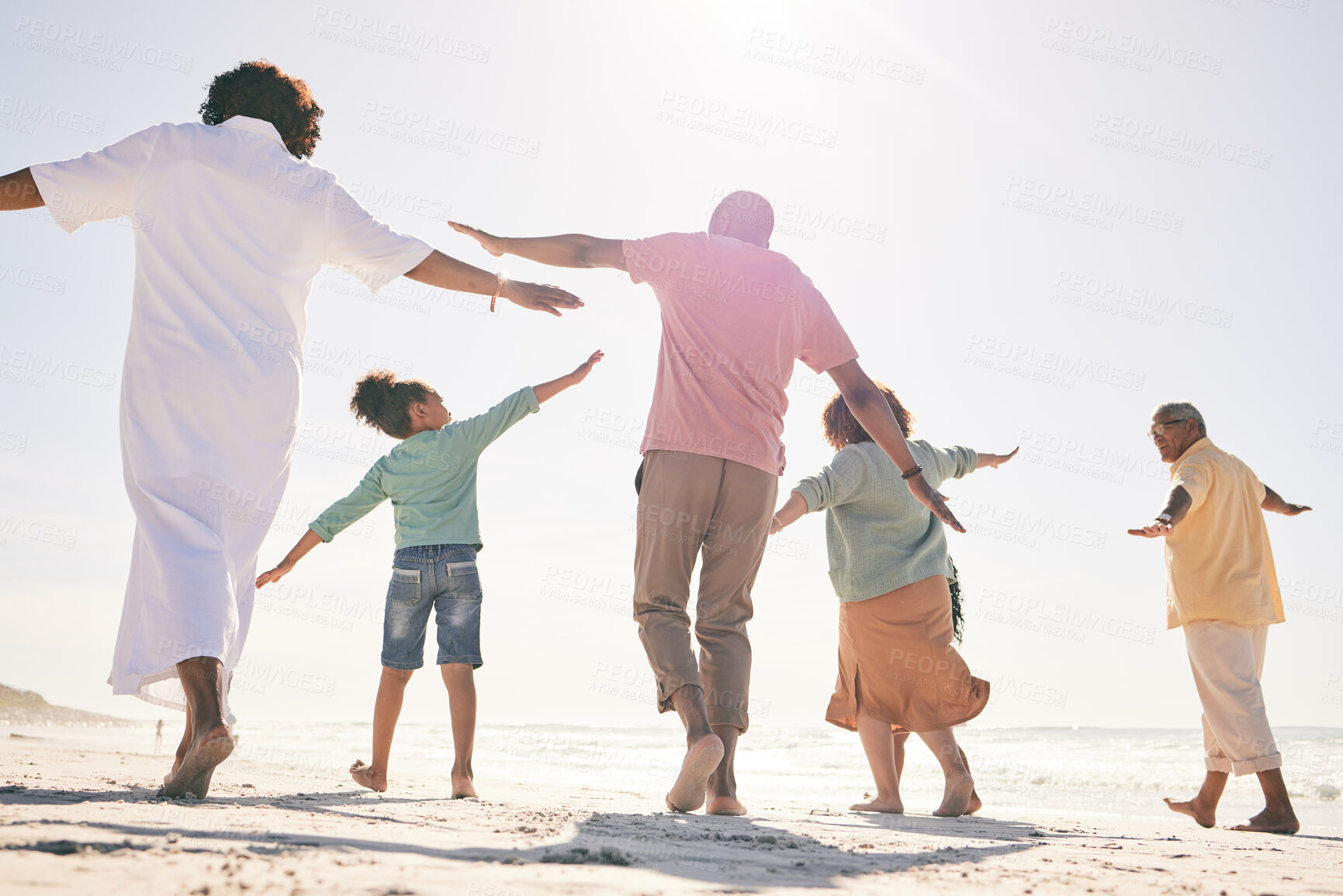 Buy stock photo Family on beach, freedom and generations on vacation with fun and grandparents, parents and kids. Travel, people outdoor and carefree, excited running and playful, happiness on adventure back view