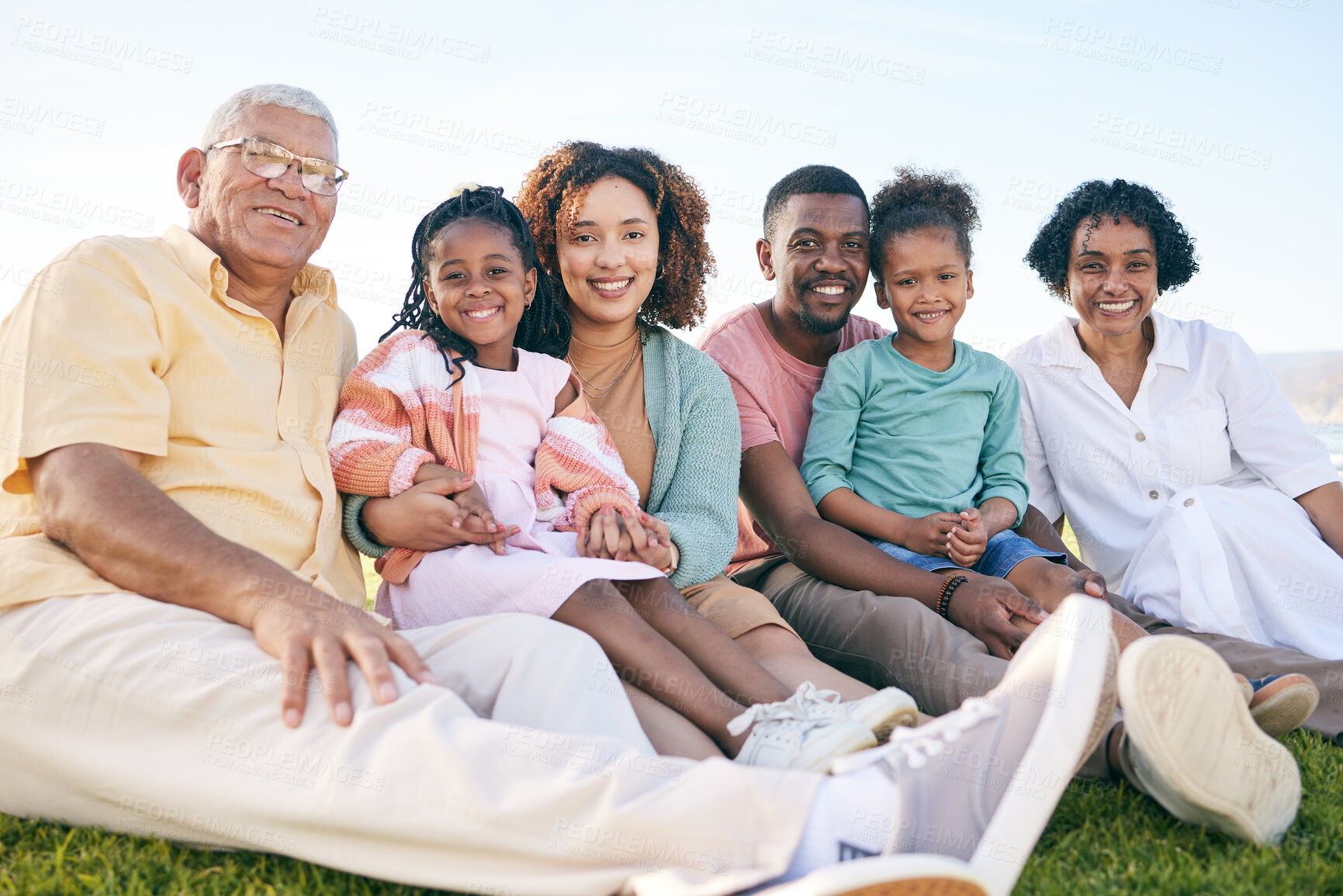 Buy stock photo Family, portrait and generations outdoor, happy people relax on lawn with grandparents, parents and kids. Happiness, smile and sitting together on grass, diversity and love with relationship and bond