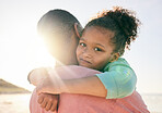 Beach, child portrait and black family hug, embrace and bond on outdoor vacation for peace, freedom and quality time. Sunshine flare, love and African youth kid, father or people together in Jamaica