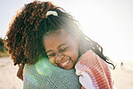 Beach, child and happy black family hug, embrace and bond on outdoor vacation for peace, freedom and quality time. Sunshine flare, nature love and African kid, mother or people smile in South Africa 