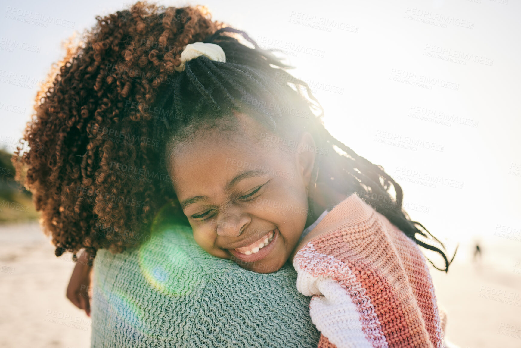 Buy stock photo Beach, child and happy black family hug, embrace and bond on outdoor vacation for peace, freedom and quality time. Sunshine flare, nature love and African kid, mother or people smile in South Africa 