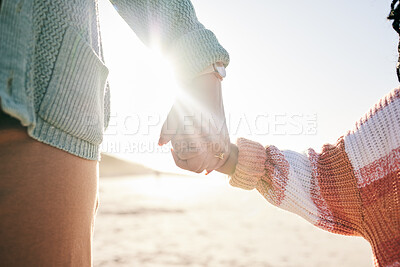 Buy stock photo Family, mother and child holding hands at beach, travel and summer with sunshine lens flare and together outdoor. Trust, support with woman and girl on vacation, love and care in nature with closeup