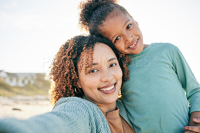 Buy stock photo Selfie, smile and portrait of mother and girl by beach for bonding, relax and hug for quality time together. Summer, happy family and mom and child take picture by sea on holiday, vacation or weekend