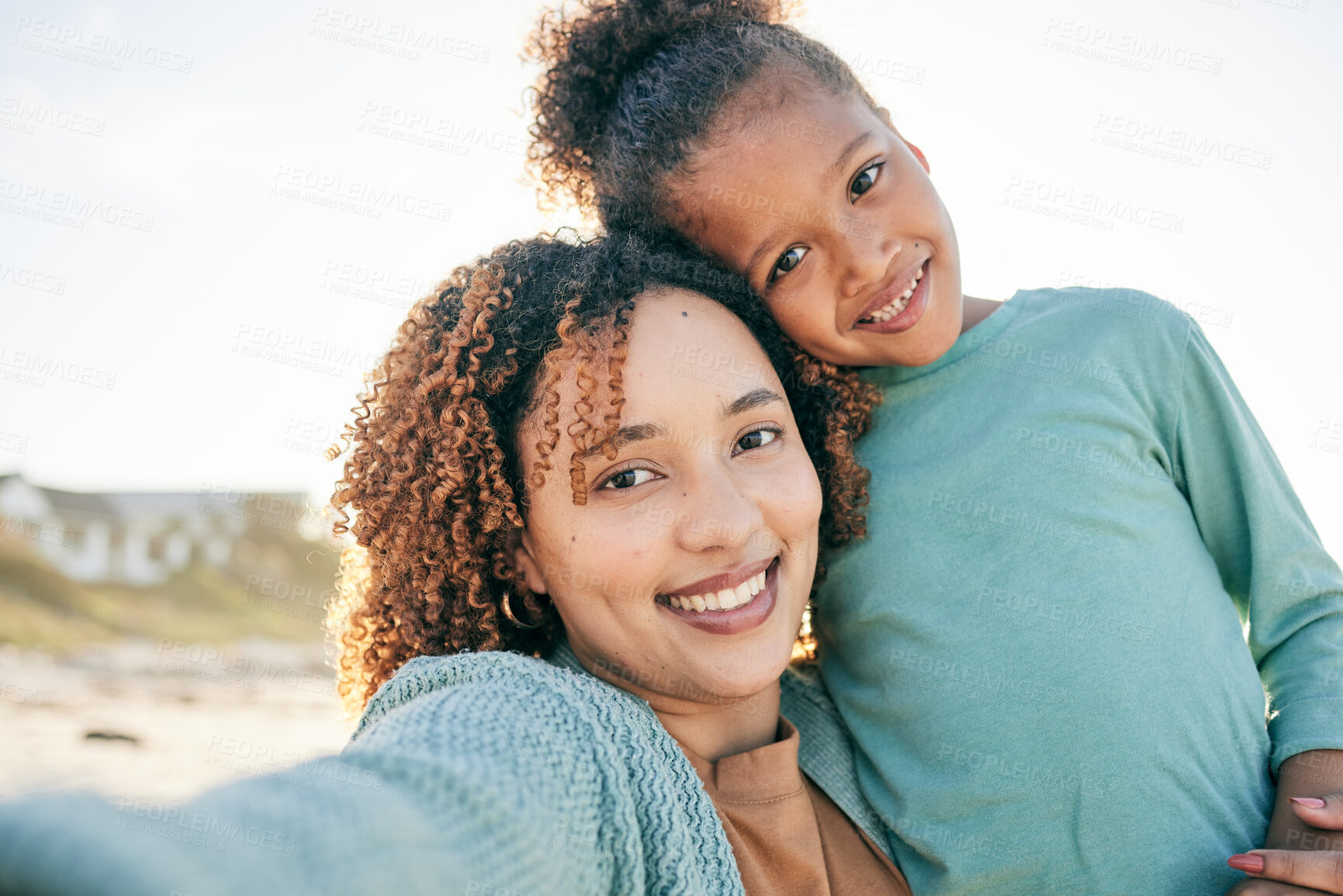 Buy stock photo Selfie, smile and portrait of mother and girl by beach for bonding, relax and hug for quality time together. Summer, happy family and mom and child take picture by sea on holiday, vacation or weekend