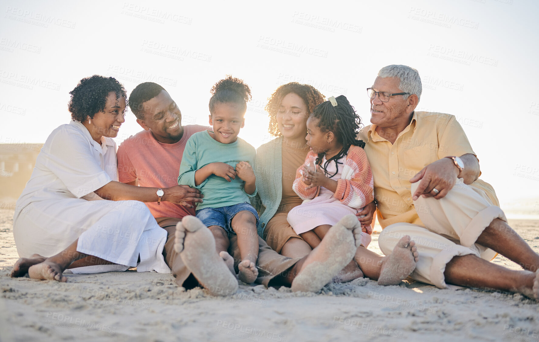 Buy stock photo Big family, grandparents or kids at beach to relax with girls or siblings on summer holiday together. Happy African dad, mom or young children love bonding or relaxing with grandmother or grandfather