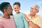 Generations, grandfather and dad with child on beach holiday in South Africa with love, happiness and freedom. Travel, happy black family and smile on summer vacation for men and kid bonding together