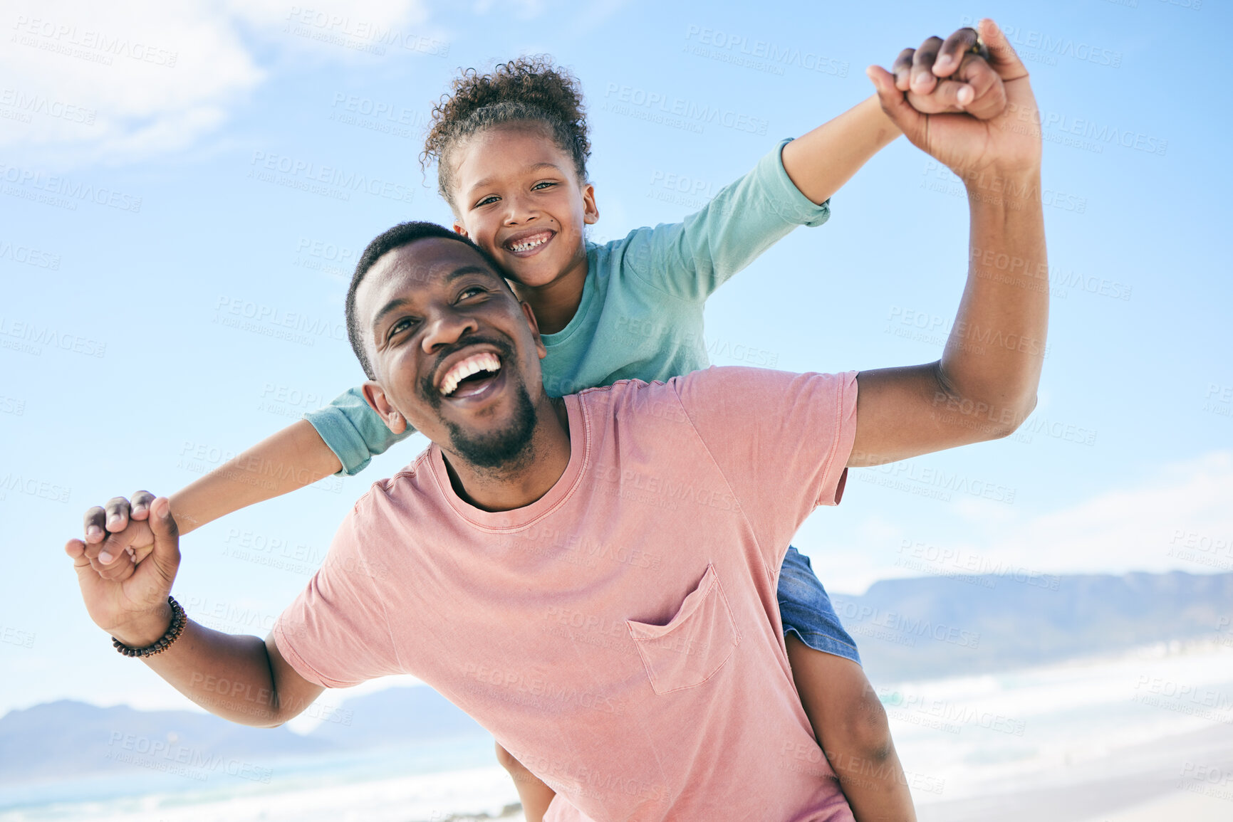 Buy stock photo Beach, black man with child on piggy back and smile on playful family holiday in Australia with freedom and fun. Travel, happy father and girl playing, flying and bonding together on ocean vacation.