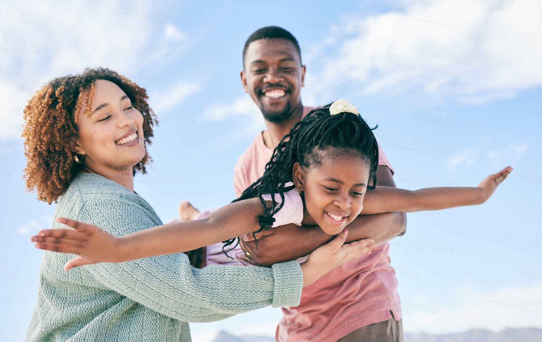 Buy stock photo Happy family, fly or girl with parents at beach on summer holiday vacation or weekend together. African dad, funny mother or excited child love bonding, laughing or relaxing while playing in nature 