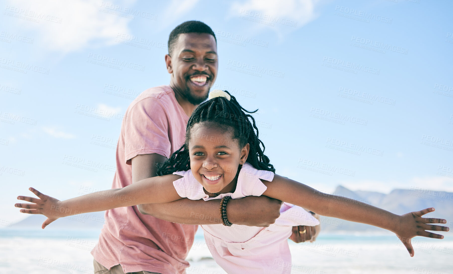 Buy stock photo Child, black man and airplane game on beach on playful family holiday in Australia with freedom and energy. Travel, fun and happy father and girl with smile playing and bonding together on vacation.